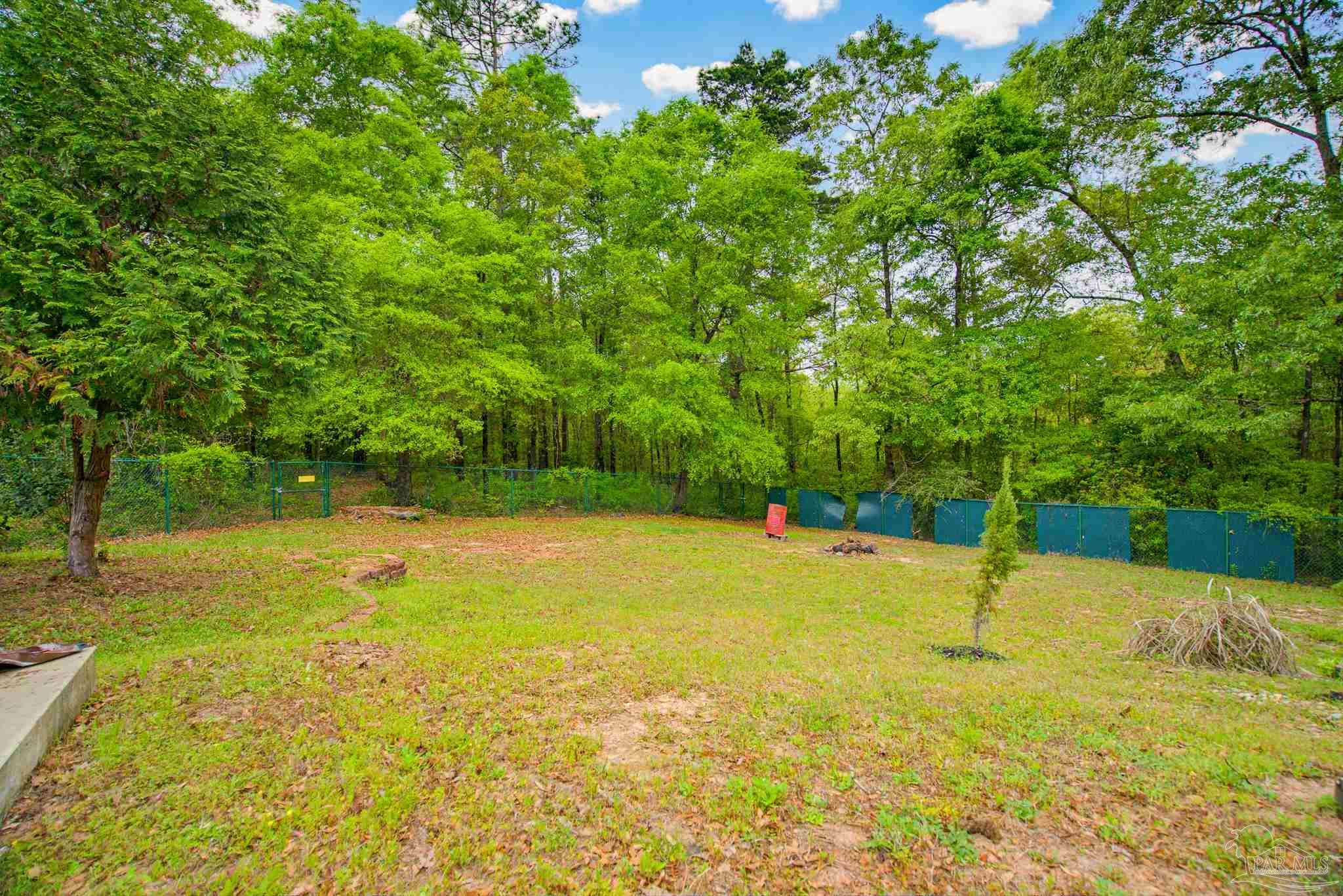2855 Walling Road Milton, FL 32570 - Photo 53 of 55 a view of a swimming pool with an outdoor space and seating area