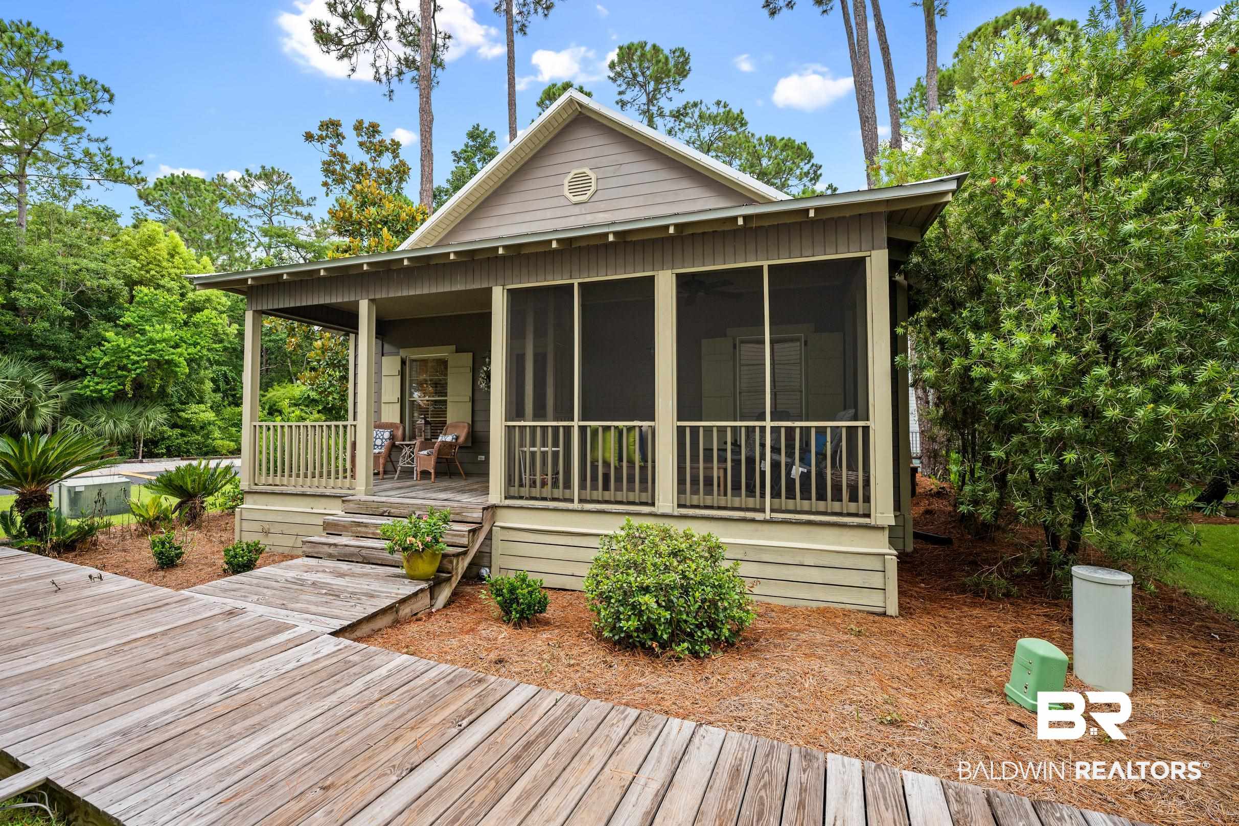 25773 Canal Road, Unit 18 Orange Beach, AL 36561 - Photo 9 of 44 Rear view of property featuring a sunroom and a deck