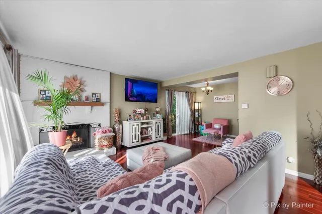 a living room with furniture fireplace and a flat screen tv