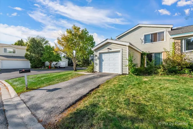 front view of a house with a yard
