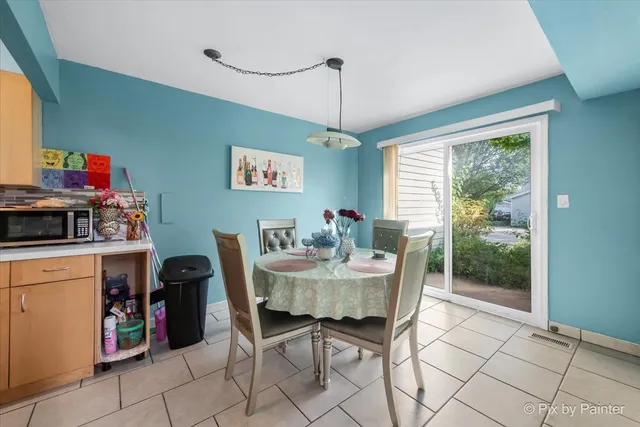 a view of a dining room with furniture window and outside view