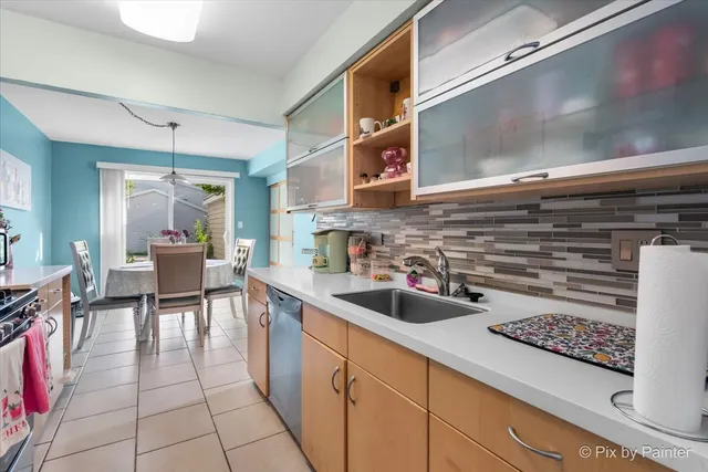 a kitchen with a sink and a stove top oven