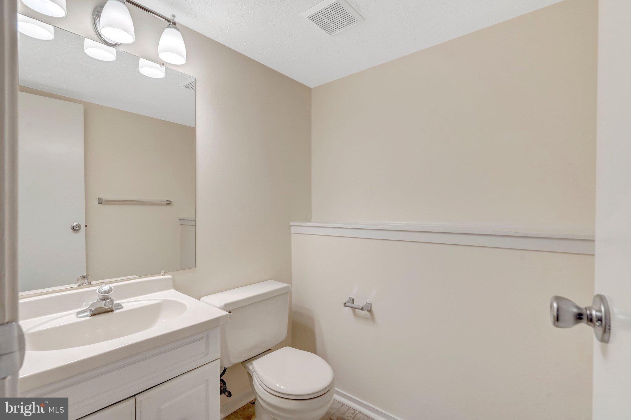 7743 Middle Valley Drive Springfield, VA 22153 - Photo 15 of 17 a bathroom with a sink a toilet and vanity