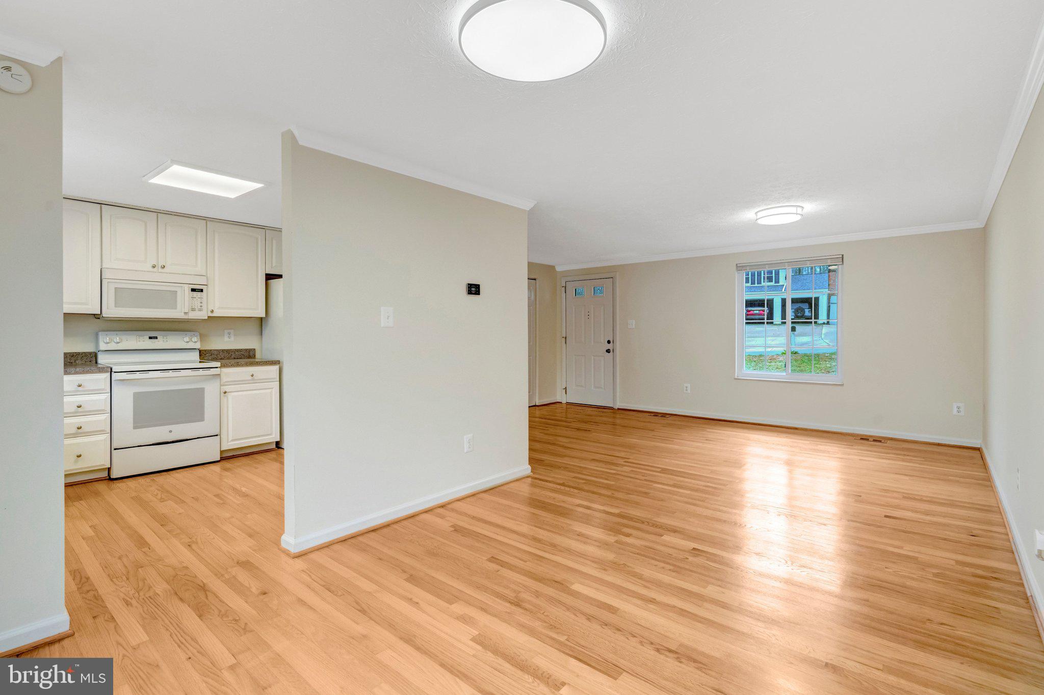 7743 Middle Valley Drive Springfield, VA 22153 - Photo 7 of 17 a view of a kitchen with wooden floor and a sink