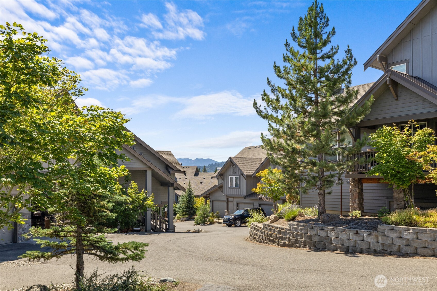 200 Clearwater Loop, Unit 1 Ronald, WA 98940 - Photo 1 of 40 a street sign on a sidewalk next to a road