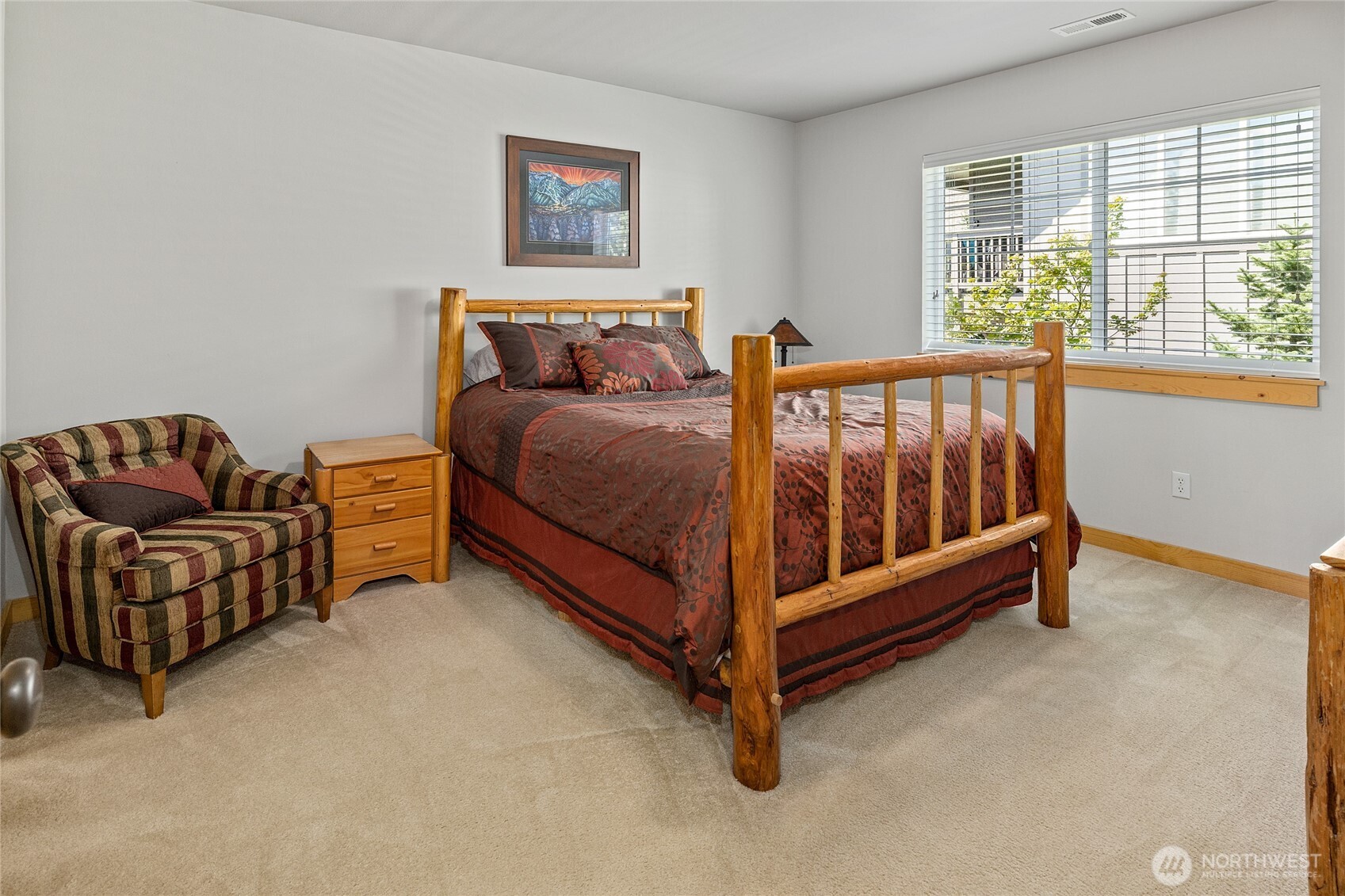 200 Clearwater Loop, Unit 1 Ronald, WA 98940 - Photo 28 of 40 a bedroom with a bed and a couch with windows