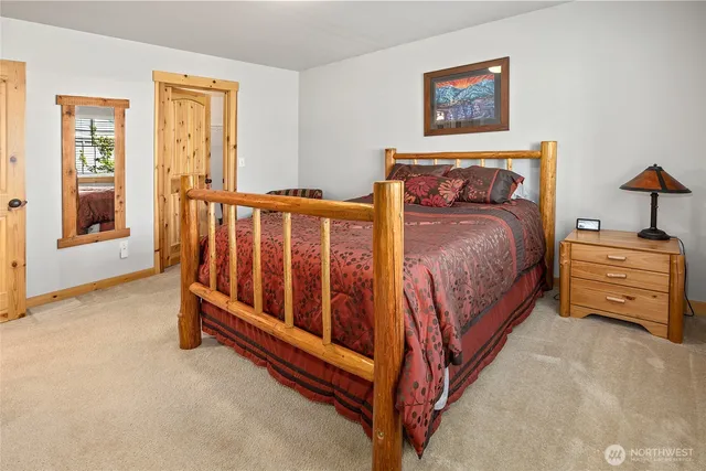 a bed room with a bed and a chair