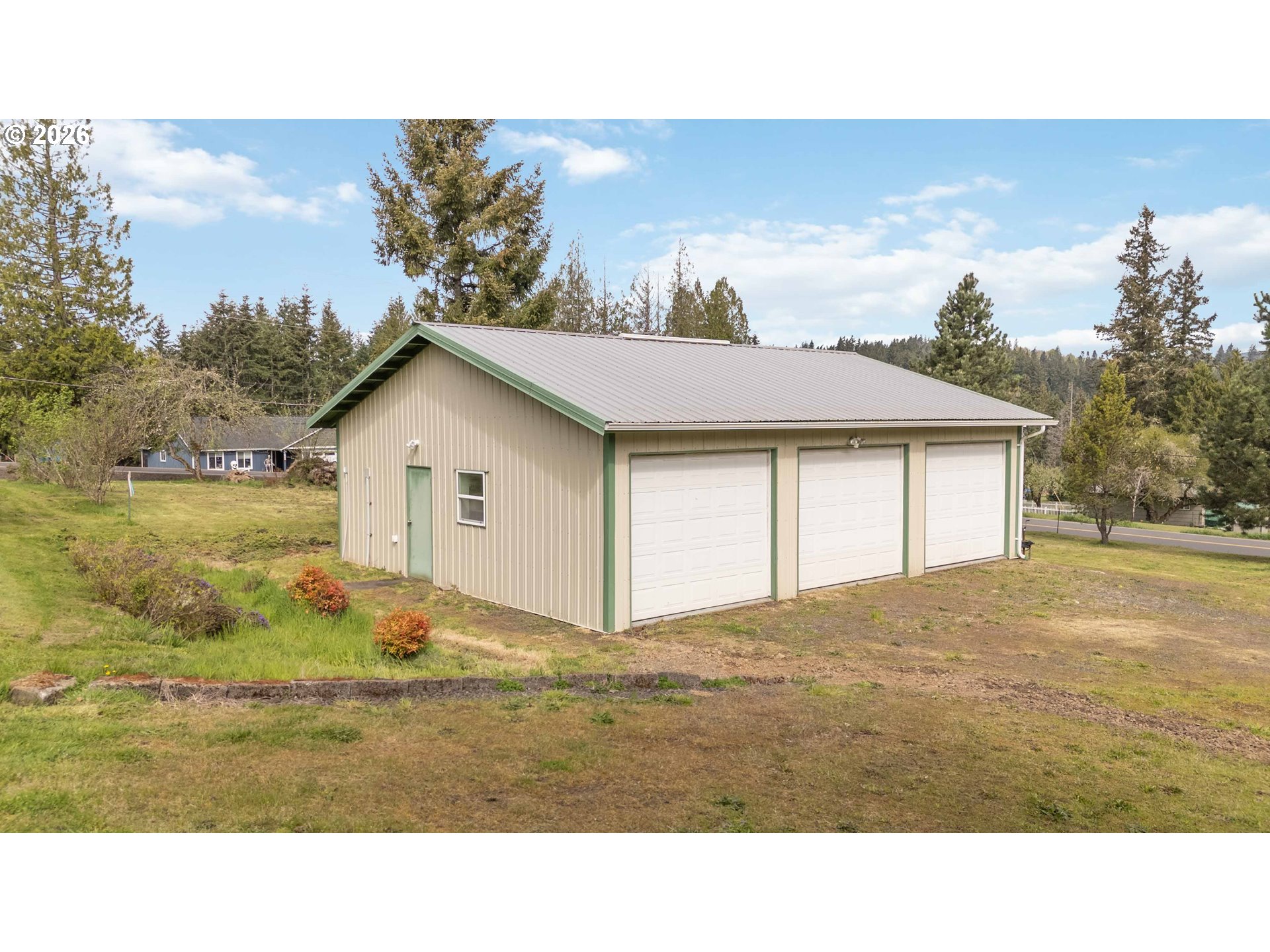 107 Bodine Road Kelso, WA 98626 - Photo 7 of 15 a view of house with backyard and garden