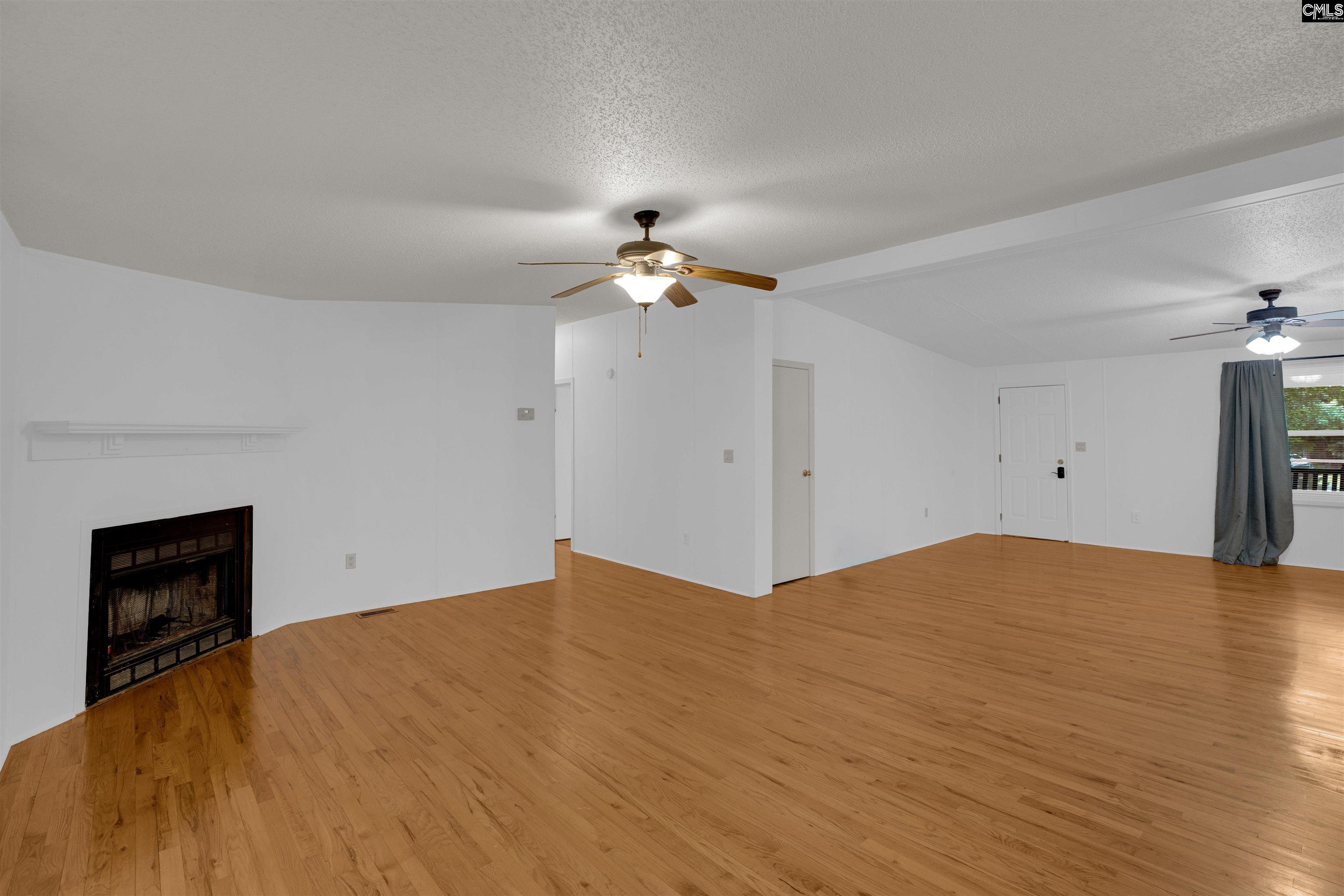 304 Cooper Road Blythewood, SC 29016 - Photo 14 of 29 a view of an empty room with a ceiling fan and window