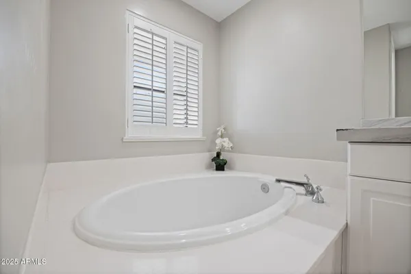 a white bath tub sitting in a bathroom