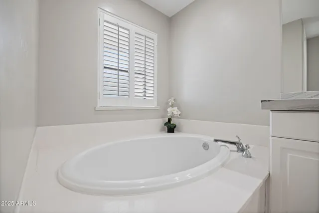 a white bath tub sitting in a bathroom