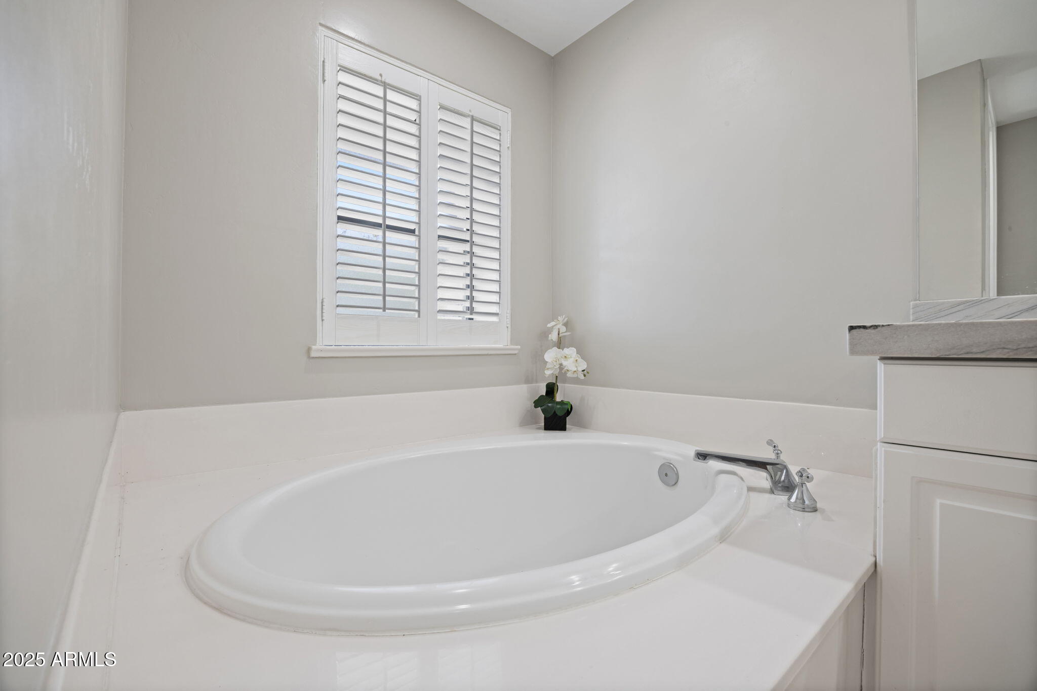 2802 East Camino Acequia Drive, Unit 8 Phoenix, AZ 85016 - Photo 17 of 34 a white bath tub sitting in a bathroom