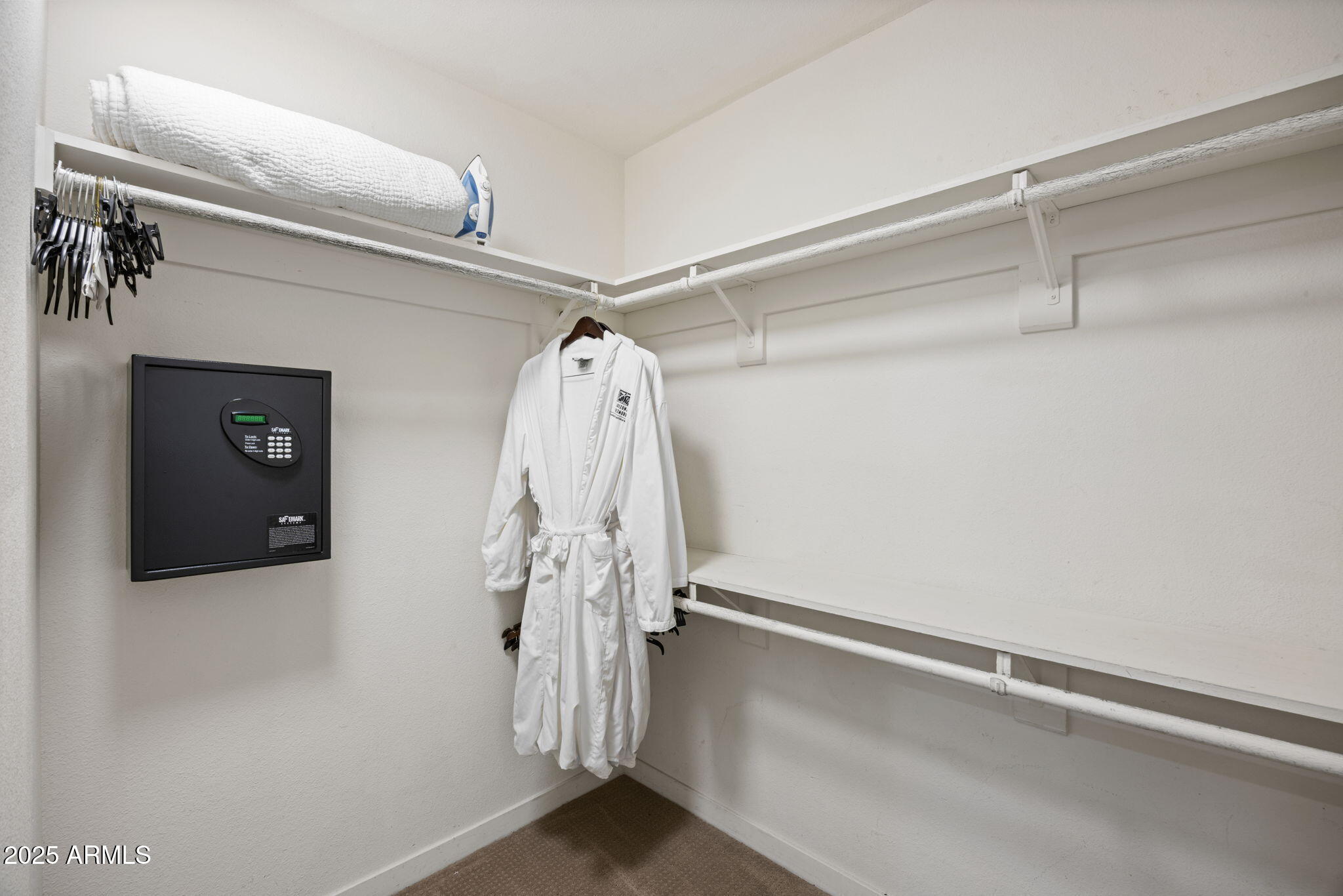 2802 East Camino Acequia Drive, Unit 8 Phoenix, AZ 85016 - Photo 19 of 34 a view of walk in closet with clothes