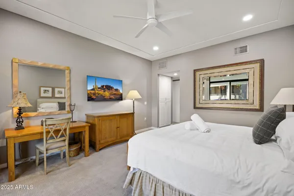 a bedroom with a bed and furniture