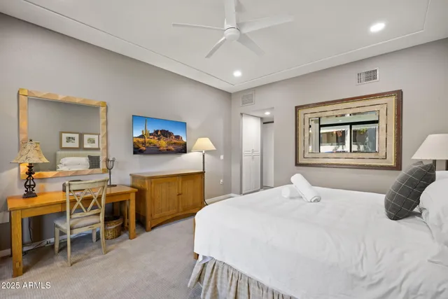 a bedroom with a bed and furniture