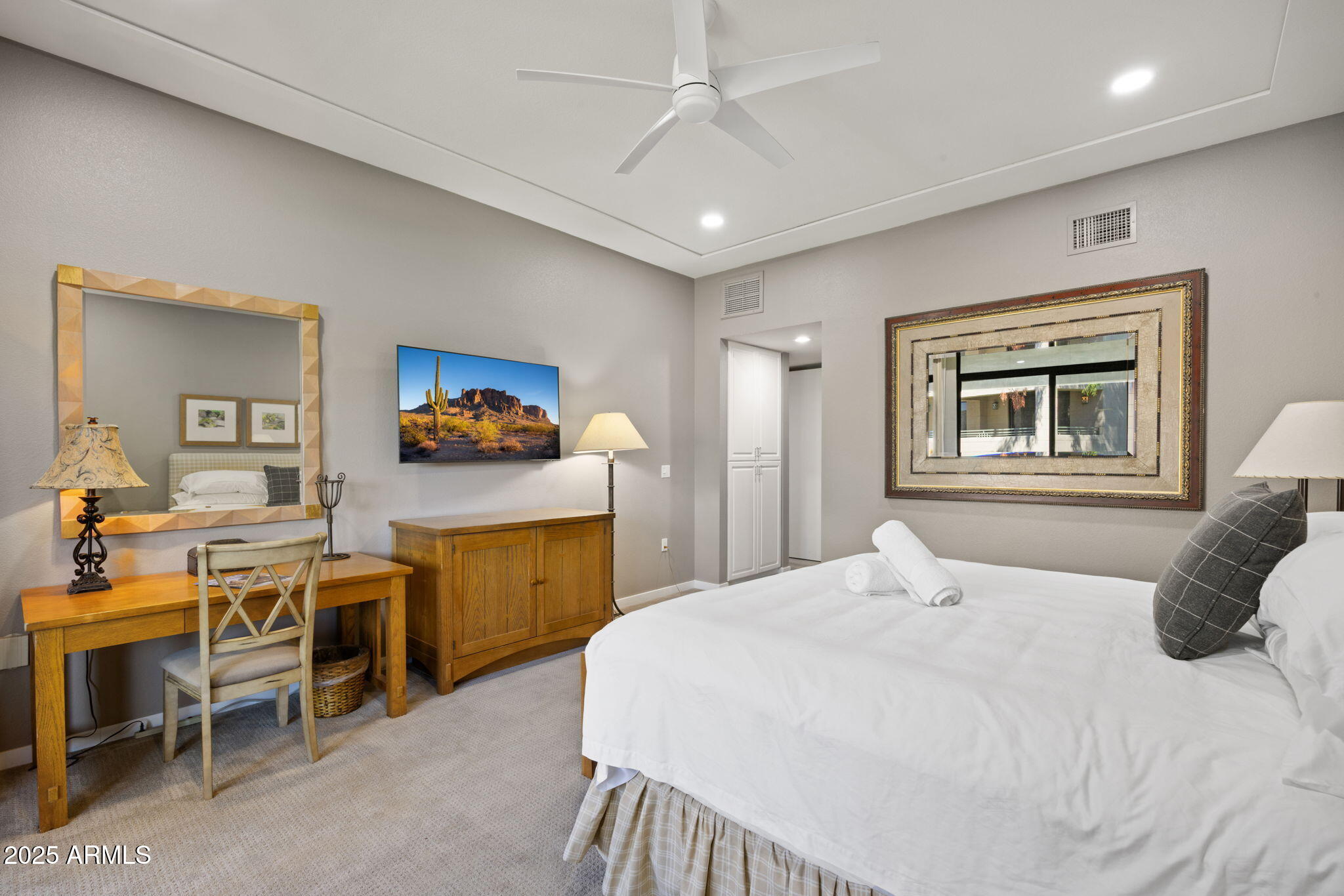 2802 East Camino Acequia Drive, Unit 8 Phoenix, AZ 85016 - Photo 21 of 34 a bedroom with a bed and furniture