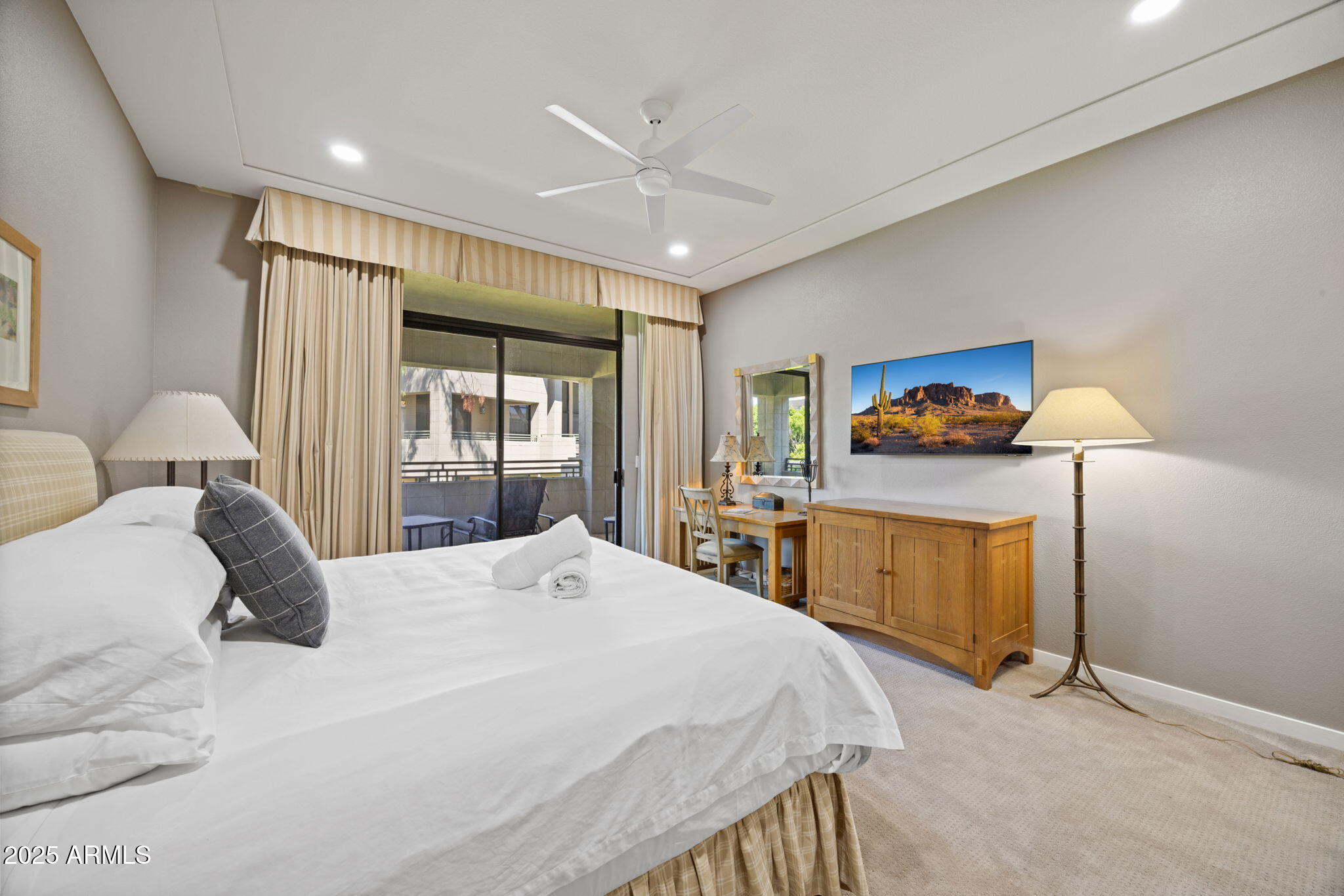 2802 East Camino Acequia Drive, Unit 8 Phoenix, AZ 85016 - Photo 22 of 34 a bedroom with a bed and a dresser