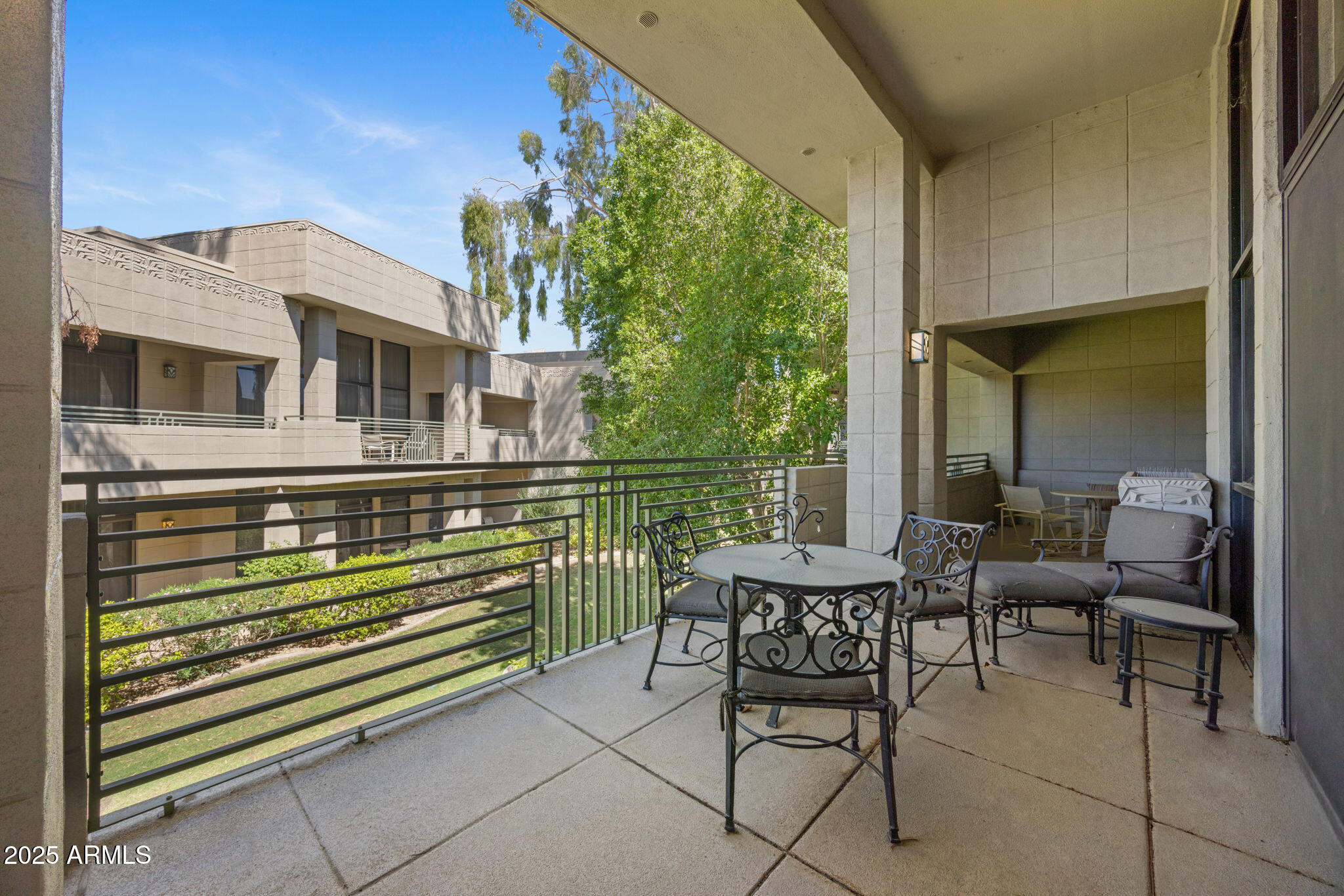 2802 East Camino Acequia Drive, Unit 8 Phoenix, AZ 85016 - Photo 28 of 34 a view of a chairs and table in the balcony