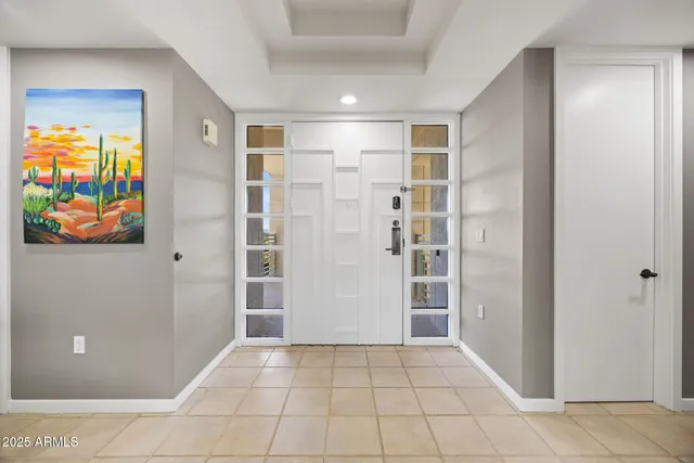 a view of an entryway with wooden floor