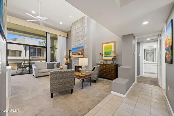 a living room with furniture and a rug