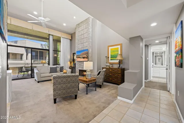 a living room with furniture and a rug
