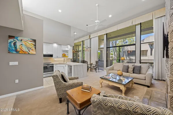 a living room with furniture and large window