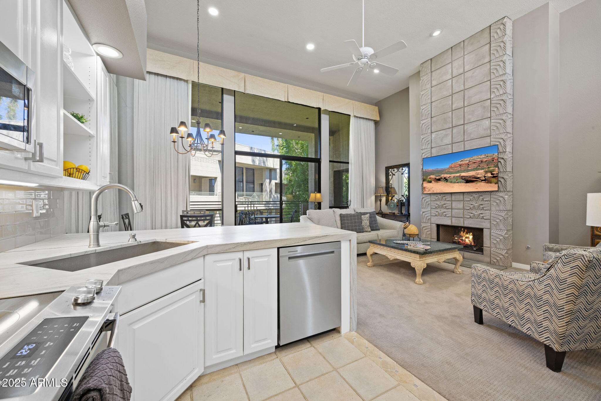 2802 East Camino Acequia Drive, Unit 8 Phoenix, AZ 85016 - Photo 10 of 34 a large white kitchen with a large window