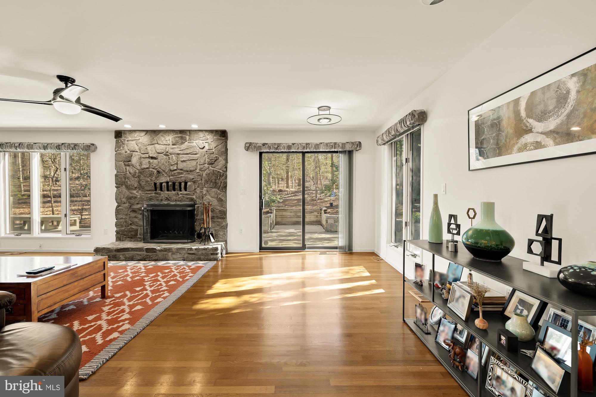 10419 Crossing Creek Road Potomac, MD 20854 - Photo 20 of 74 a bedroom with furniture and a fireplace