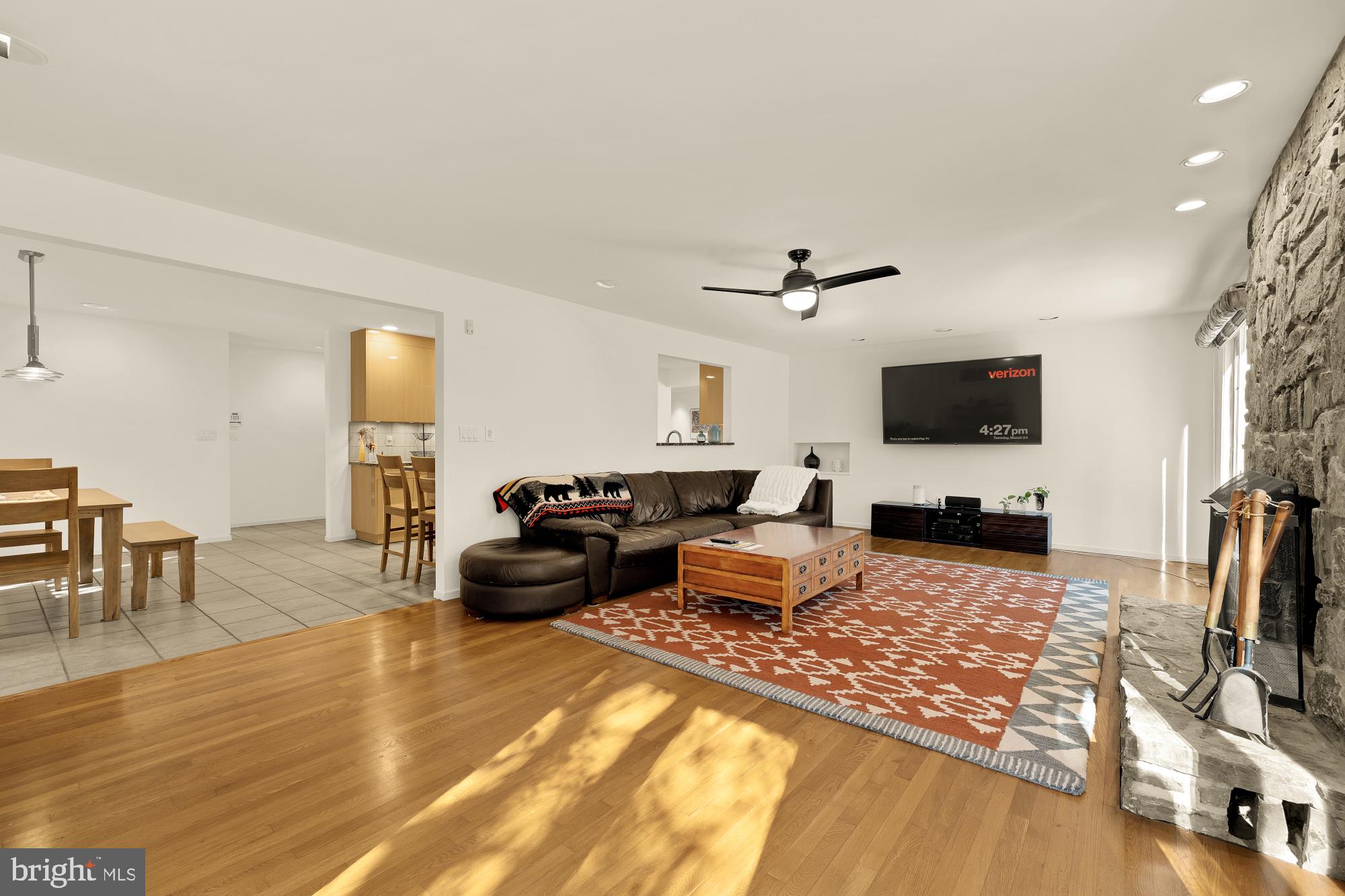 10419 Crossing Creek Road Potomac, MD 20854 - Photo 24 of 74 a living room with furniture and a flat screen tv