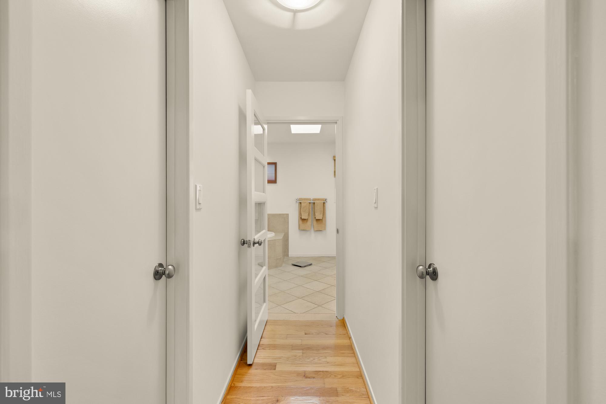10419 Crossing Creek Road Potomac, MD 20854 - Photo 29 of 74 a view of a bathroom from a hallway