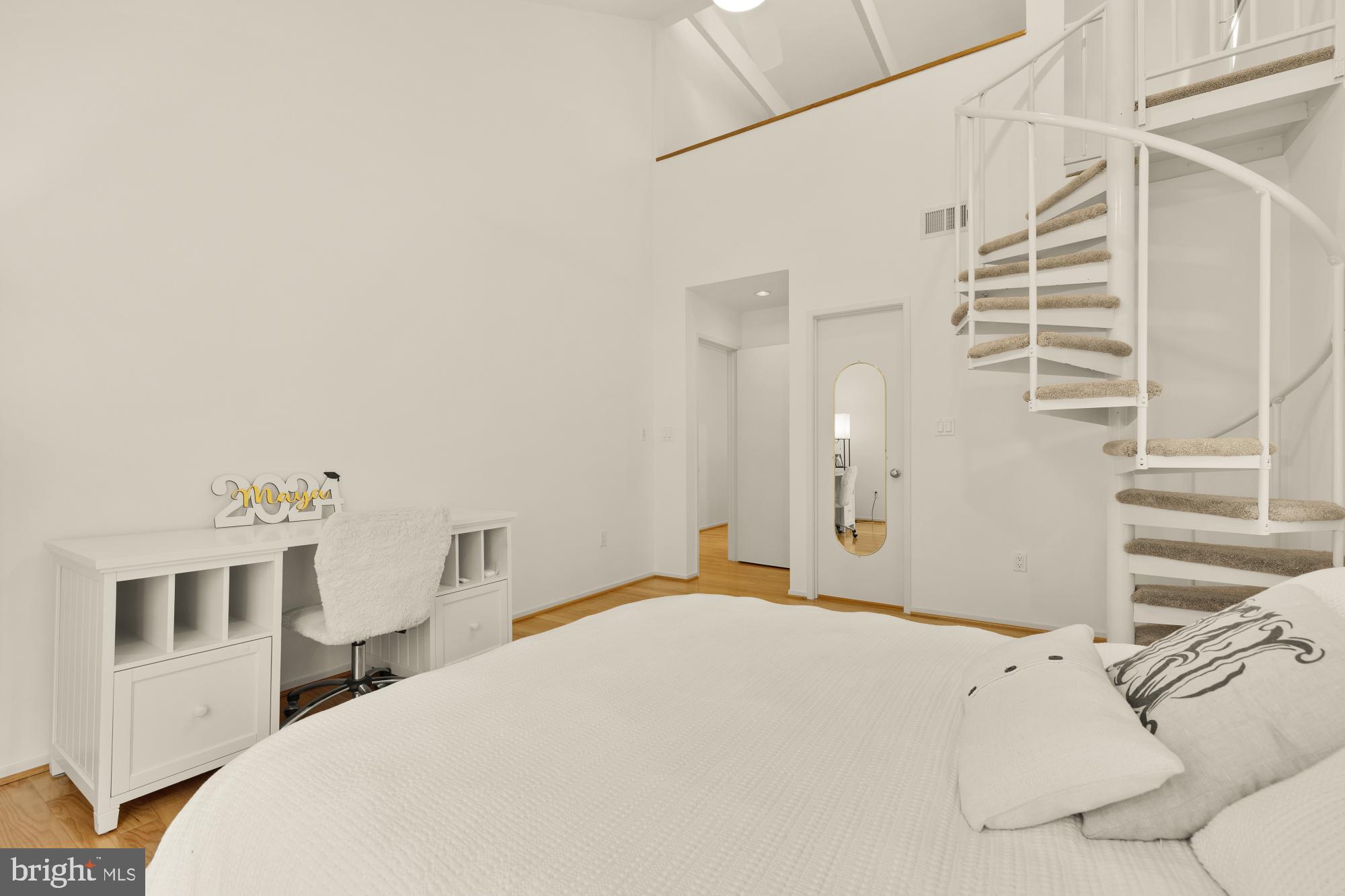 10419 Crossing Creek Road Potomac, MD 20854 - Photo 42 of 74 a bedroom with a bed and a cabinets