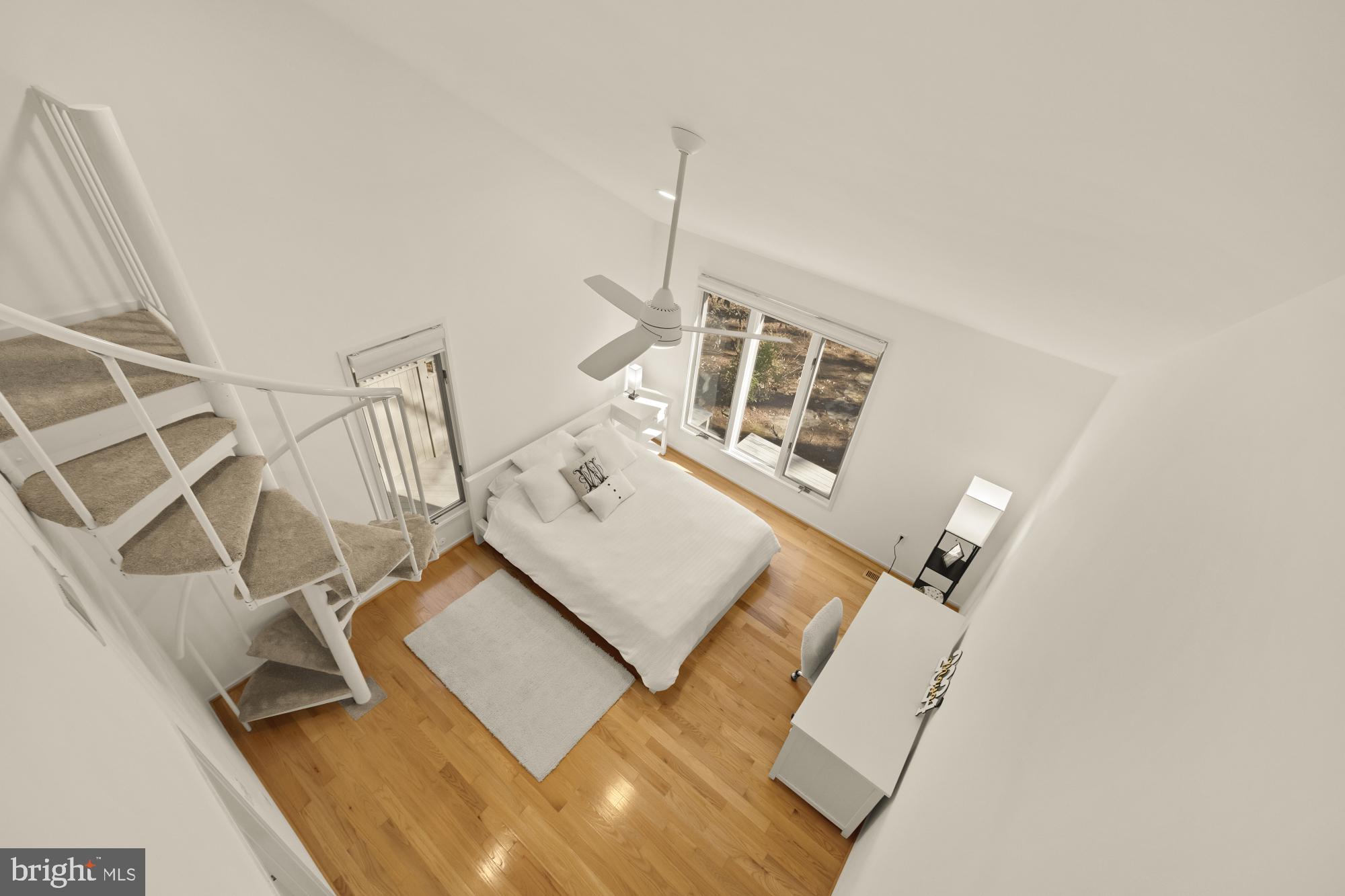 10419 Crossing Creek Road Potomac, MD 20854 - Photo 44 of 74 a living room with a bed furniture and a wooden floor