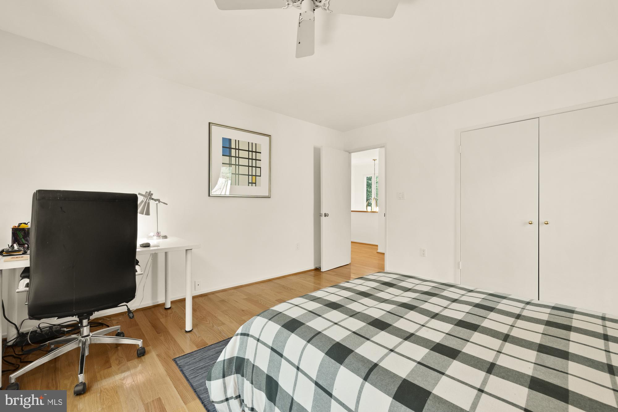 10419 Crossing Creek Road Potomac, MD 20854 - Photo 47 of 74 a bedroom with a bed and a flat screen tv