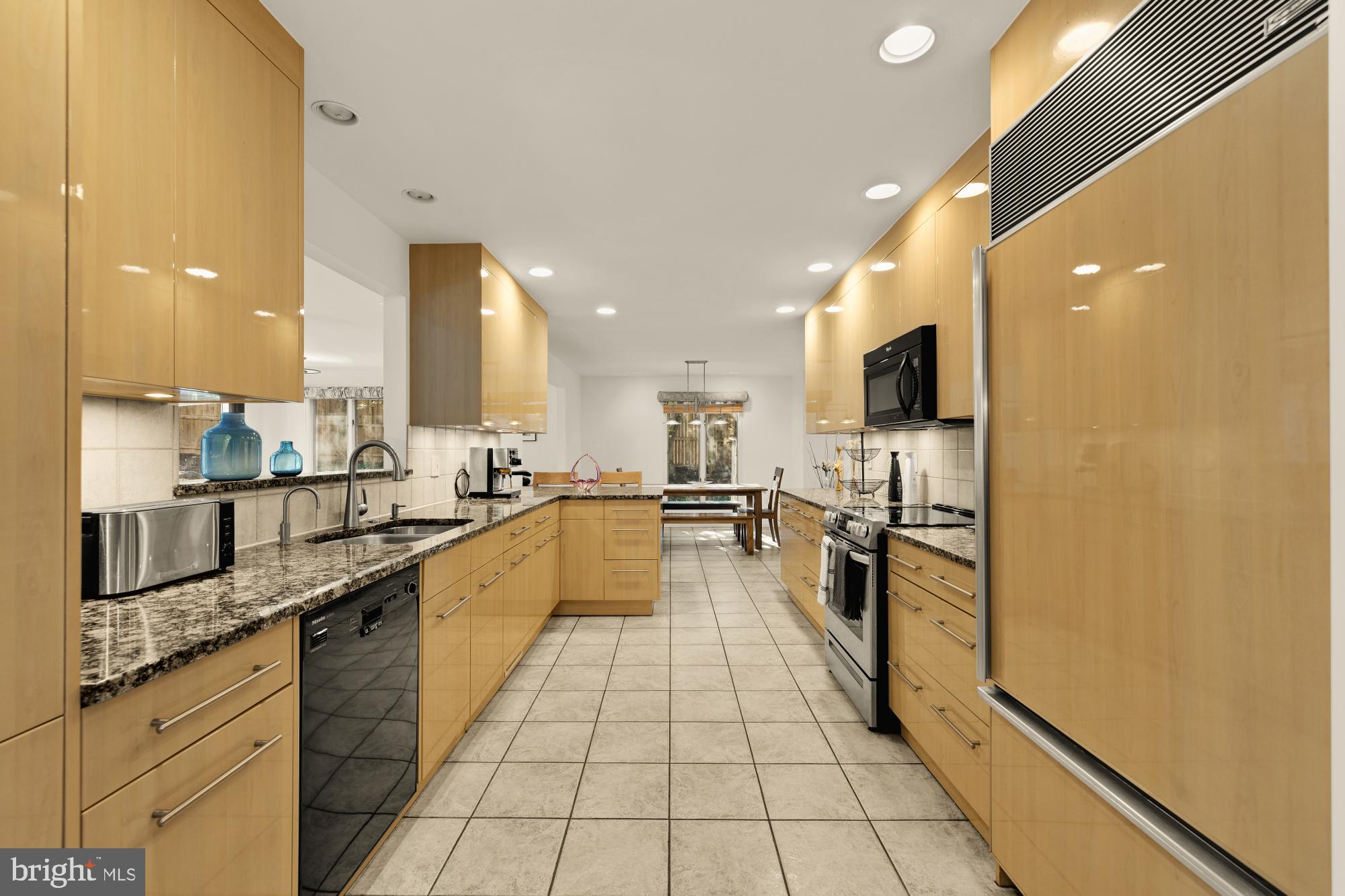 10419 Crossing Creek Road Potomac, MD 20854 - Photo 7 of 74 a large kitchen with stainless steel appliances lots of counter top space