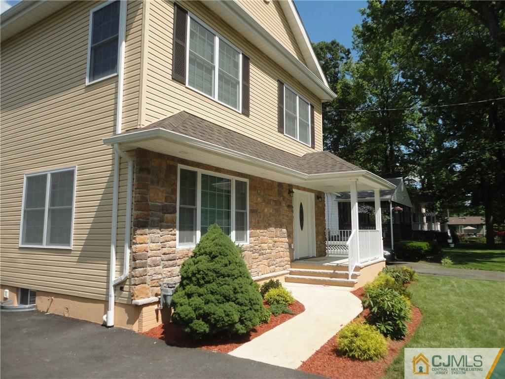 715 Spruce Road North Brunswick, NJ 08902 - Photo 2 of 23 a front view of a house with a garden