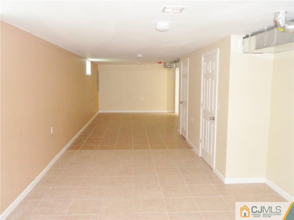 715 Spruce Road North Brunswick, NJ 08902 - Photo 18 of 23 a view of hallway with a large window
