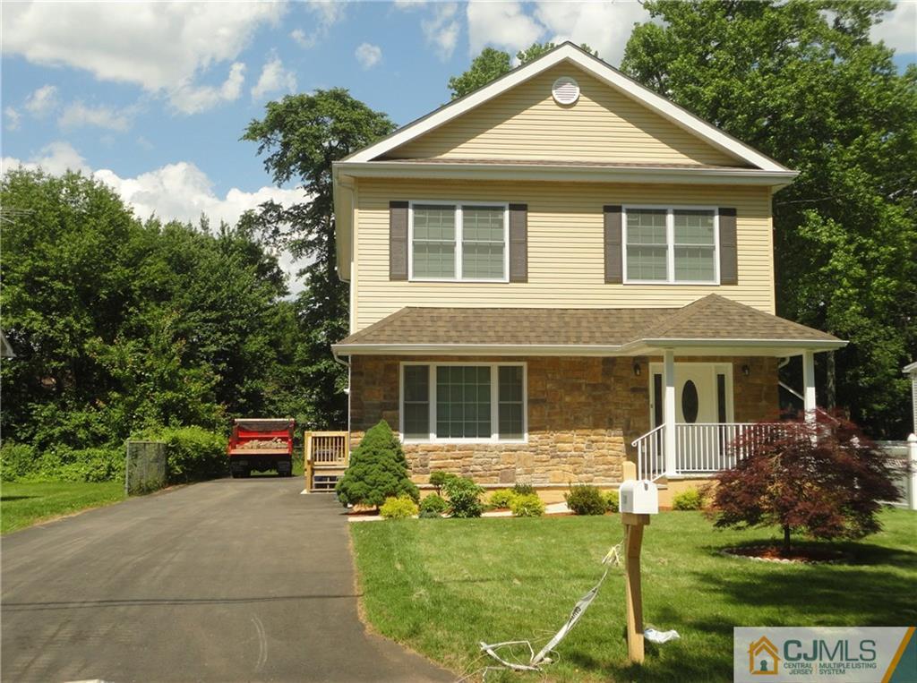 715 Spruce Road North Brunswick, NJ 08902 - Photo 3 of 23 a front view of a house with a garden