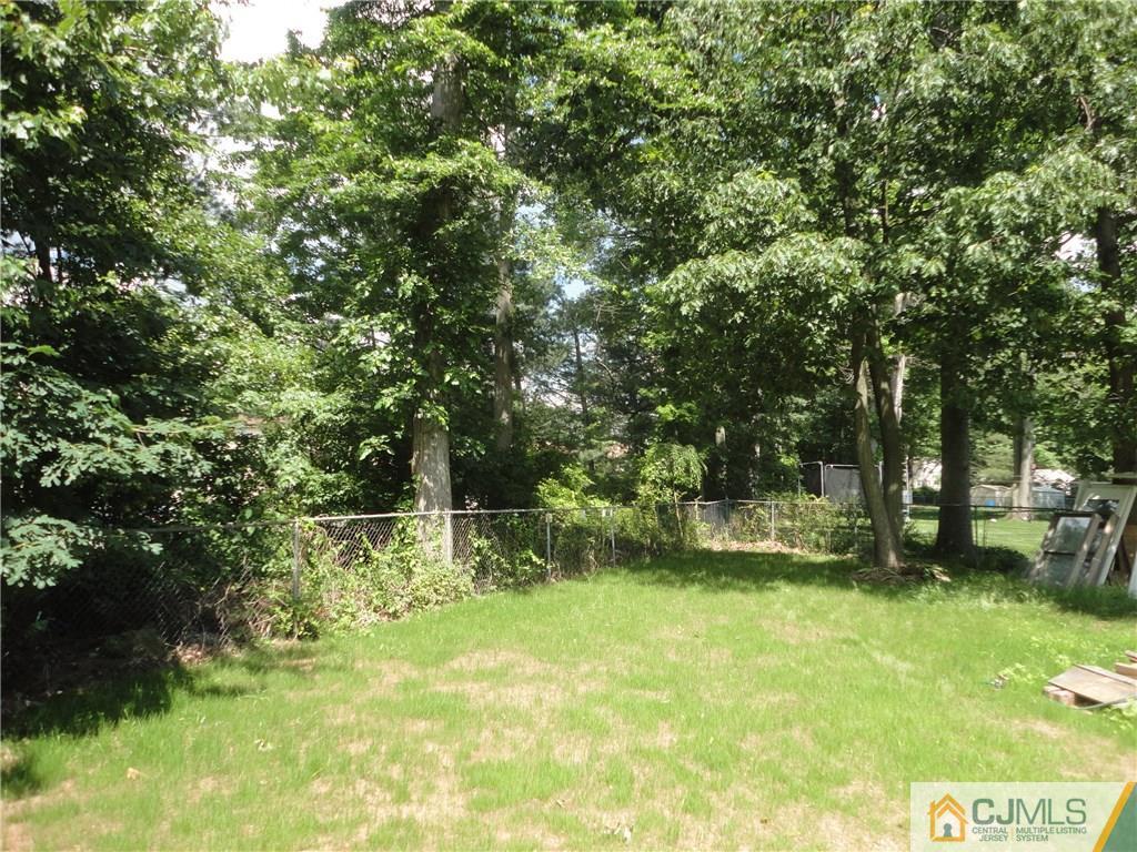 715 Spruce Road North Brunswick, NJ 08902 - Photo 23 of 23 a view of yard with green space and trees