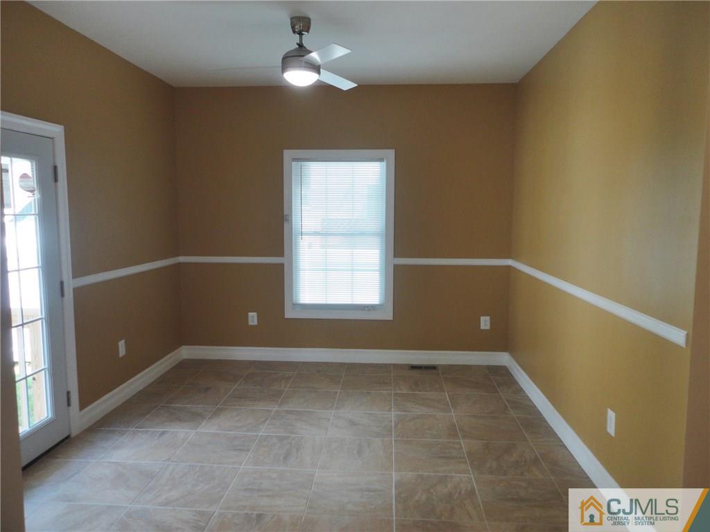 715 Spruce Road North Brunswick, NJ 08902 - Photo 6 of 23 a view of room with window and ceiling fan