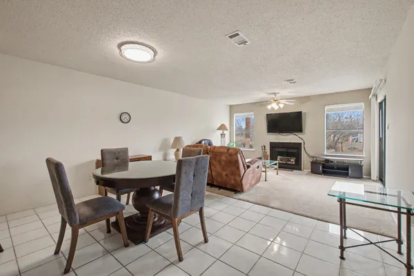 a view of a livingroom with furniture and a flat screen tv