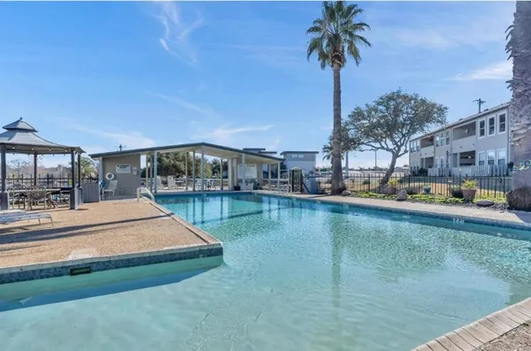 a view of a swimming pool with a patio