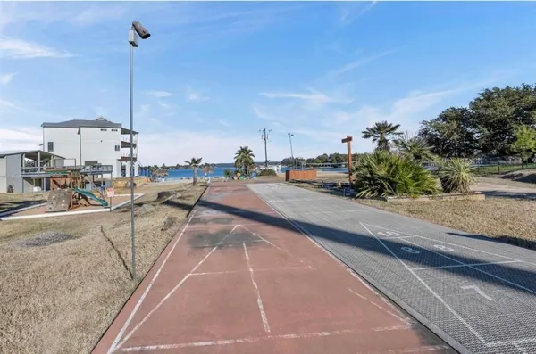 a view of a swimming pool with a lounge chairs