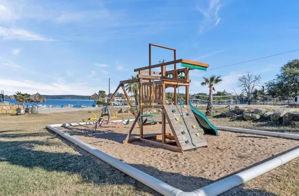 a view of a park with large trees