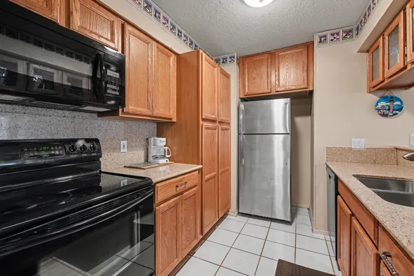 a kitchen with a stove microwave and refrigerator