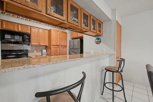 a kitchen with a stove a sink and a microwave