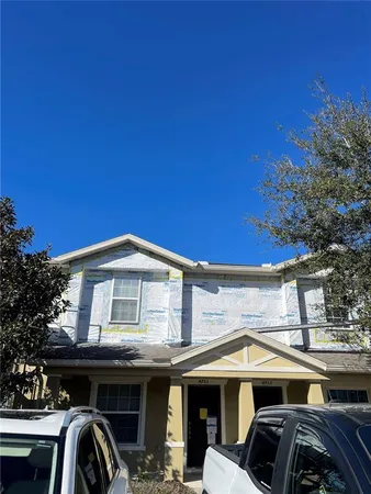 a front view of a house with parking space
