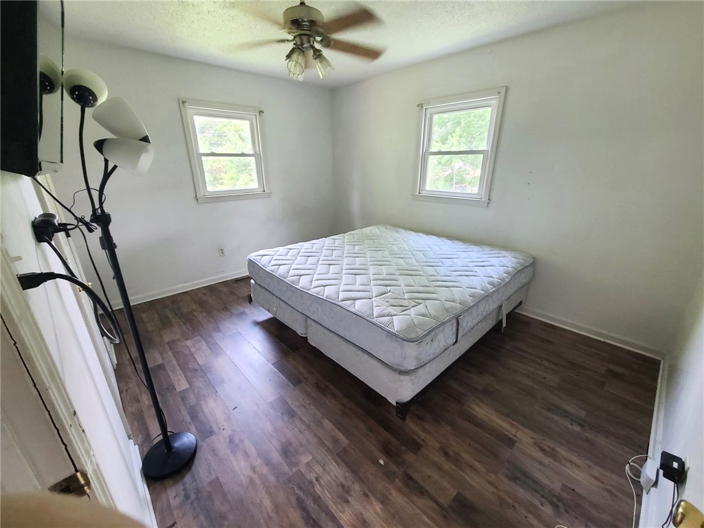 110 Ridgemont Court Greenwood, SC 29649 - Photo 12 of 14 Hardwood floors and generous natural light create an inviting sleeping space.