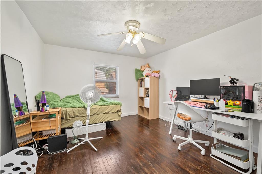 1627-1629 Laketon Road Pittsburgh, PA 15221 - Photo 13 of 26 a workspace with furniture and wooden floor