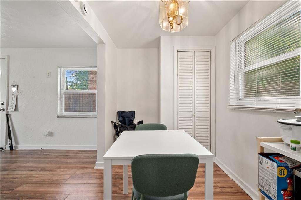 1627-1629 Laketon Road Pittsburgh, PA 15221 - Photo 17 of 26 a room with a bed a window and a chandelier