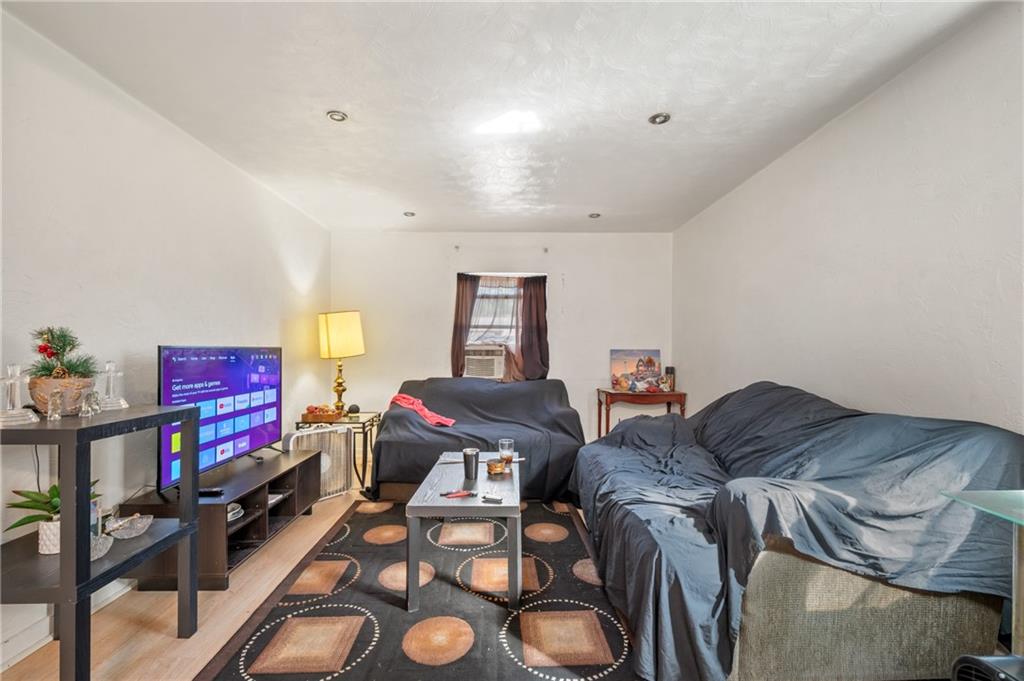 1627-1629 Laketon Road Pittsburgh, PA 15221 - Photo 25 of 26 a living room with furniture and a couch